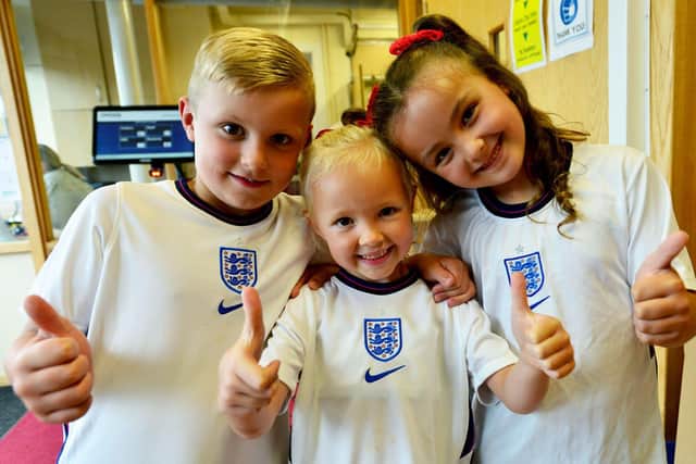 Thumbs up for England: Rossmere Primary School pupils Charlie Brackstone, Peyton Butler and Gracie Hodgson.