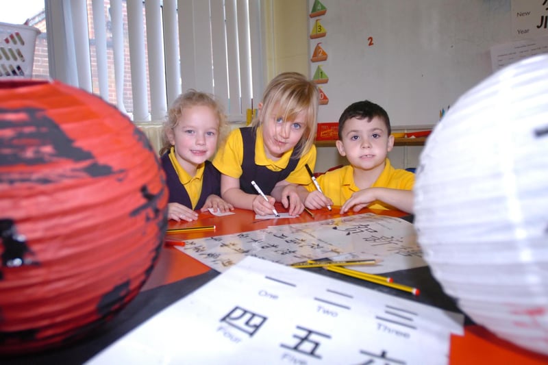 It's 2009 and this picture shows Sarah Martin, Lucy Wright and Luke Elsdon at the Golden Flatts Primary School Chinese New Year celebrations.