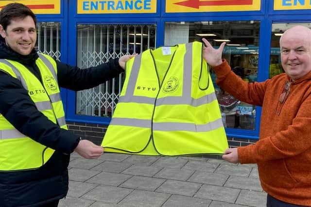 Dave Hunter (right) from Poolie Time Exchange presents a Hi-Viz vest to Jason Bland from Hartlepool Big Tidy Up Group. Picture by FRANK REID