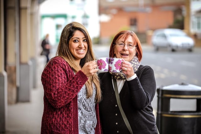 Bee Kaur (left) and Judith Temple, from from Northgate Fish Bar and CMB Fruitiers, host a Macmillan Coffee Morning in 2015.