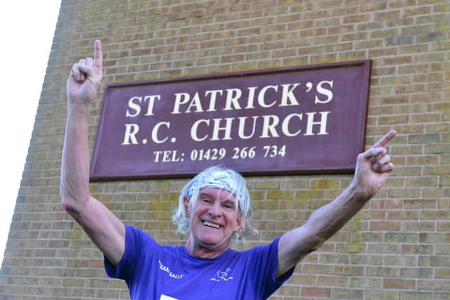 Phil Holbrook celebrates completing the St Patrick's Day hat-trick half marathon.