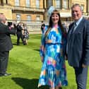 Louise and Jason Anderson in the garden of Buckingham Palace.