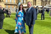 Louise and Jason Anderson in the garden of Buckingham Palace.