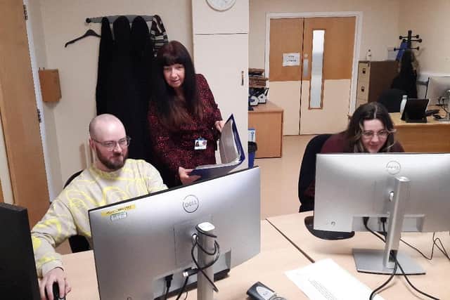 Apprentices Keiran Kitching and Lydia Gooding at work at the North Tees and Hartlepool NHS Foundation alongside single point access manager Angela McMurray.