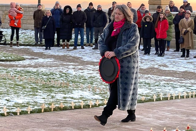 Jill Mortimer, MP for Hartlepool, lays a wreath.