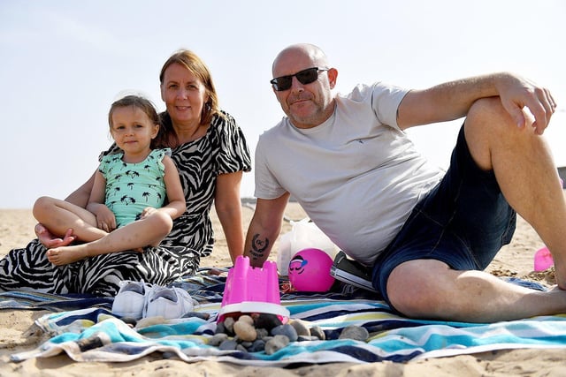 Debbie and Mark Alwdlie are enjoying the beach with their granddaughter Amelia in Seaton Carew.