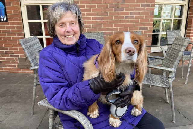 Susan Harrington with her dog Daoiy as they wait for their coffee to arrive at Ward Jackson Park.