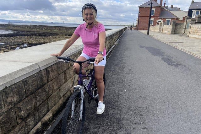 Nicola Cooke photographed as she goes for a ride along the sea wall at the Headland.