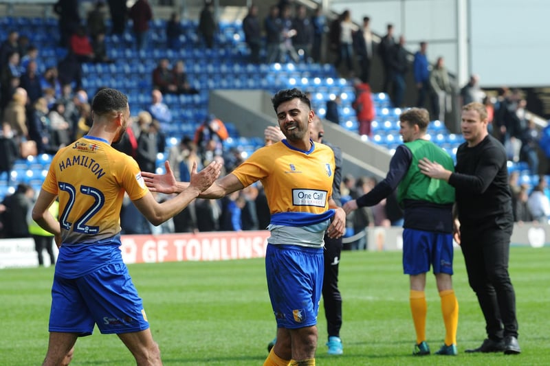 Mal Benning is congratulated on his legendary winning goal by CJ Hamilton after the final whistle at Chesterfield.