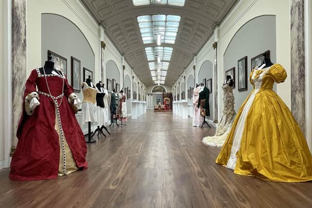 Dresses on display at the Script to Screen exhibition in the Picture Gallery at Heatherden Hall, Pinewood Studios.