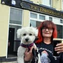 The Fisherman's Arms landlady Hazel Whitelock and pub dog Sunny are ready to welcome customers back.