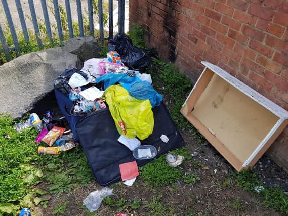 Suitcases filled with children's toys and household waste were among the dumped rubbish at Lime Crescent