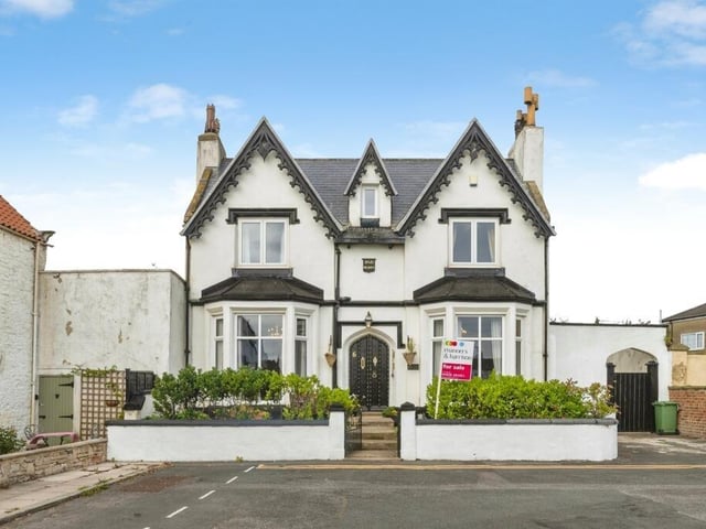 This detached home has five bedrooms, three bathrooms and sea views.