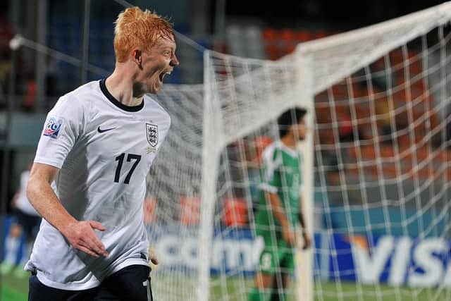 England's Luke Williams (L) reacts after scoring a second goal during a group stage football match between England and Iraq at the FIFA Under 20 World Cup at the Akdeniz University Stadium in Antalya on June 23, 2013 (Photo credit should read OZAN KOSE/AFP via Getty Images)