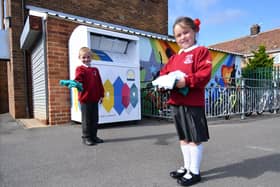 West View Primary School pupils Ashton Perry and Gracie Rowbotham with clothing items for the clothing bank at the school.