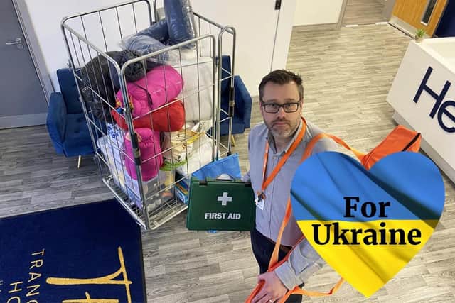 Glen Hughes from Orangebox with some of the donations for Ukraine received at Tranquility House.