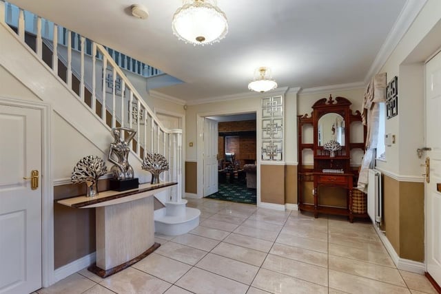 The large entrance hall benefits from under stairs storage space.