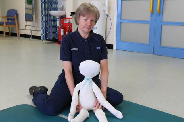 Karen Roach with the physiotherapy doll.