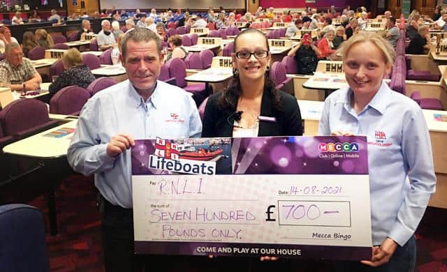 Chris Hornsey and Jane Mandeville of Hartlepool RNLI receiving the cheque from Hartlepool Mecca manager Michelle Doherty.