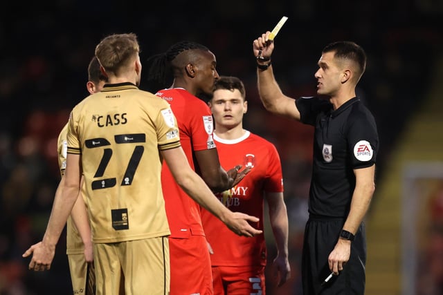 Omar Beckles of Leyton Orient is shown a yellow card. It was one of 100 yellows for the Londoners.