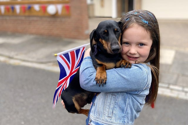 Charlotte Hall with her dog Albert waving their Union Jack for the Queen's Jubilee celebrations on Cresswell Road. Picture by FRANK REID