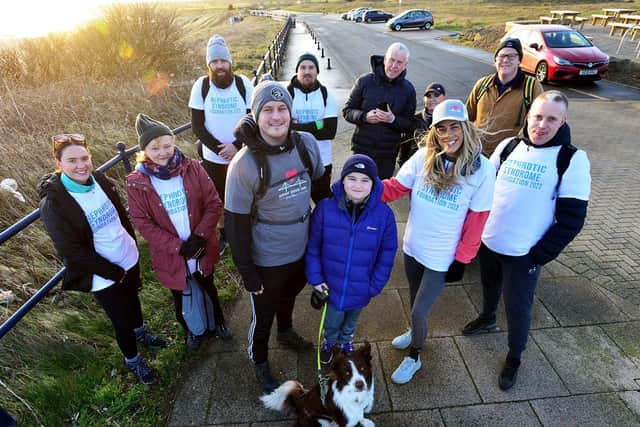 Craig Adair with his dad Craig, mum Sophie Young and fellow charity walkers before they set off for the walk./Photo: Frank Reid