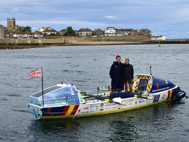 Charlie Fleury and Adam Baker stand in their boat in Hartlepool's harbour.