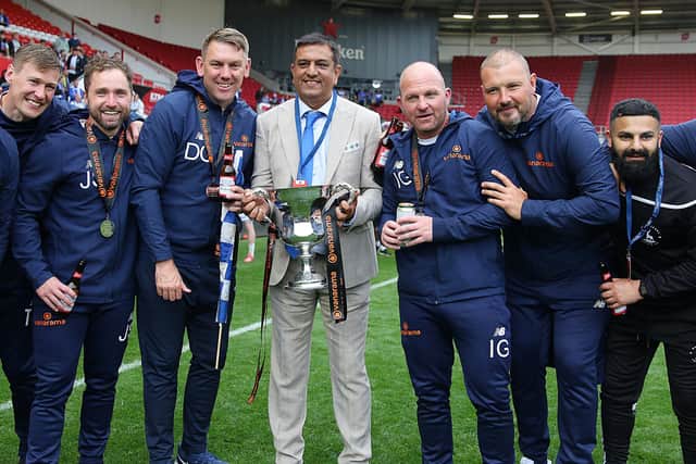 Hartlepool United chairman Raj Singh with the club's coaching staff, Ross Turnbull second from right.