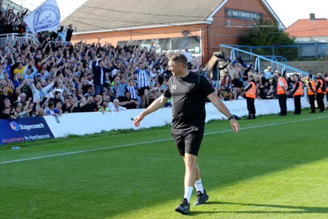 Hartlepool United manager Dave Challinor celebrates with the fans after the Sky Bet League 2 match between Hartlepool United and Carlisle United at Victoria Park, Hartlepool on Saturday 28th August 2021. (Credit: Mark Fletcher | MI News)