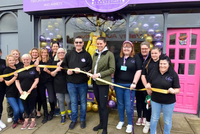 WBO middle weight champion boxer Savannah Marshall opens the  Fibro Connect shop with Stephen Picton joined by volunteers.