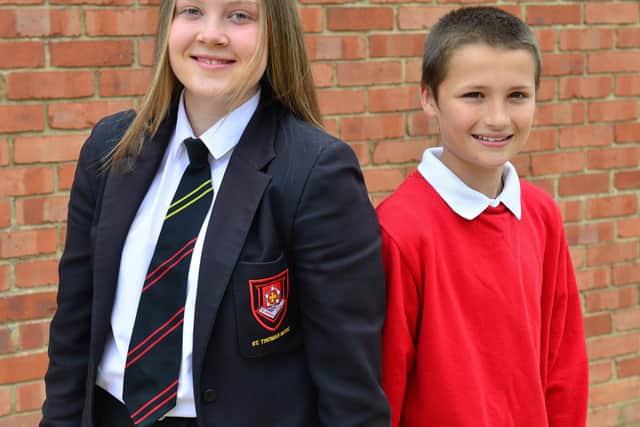 Leah and brother Robert Coulson, aged 11, who has achieved six out of seven years full attendance at Sacred Heart Primary School. Picture by FRANK REID