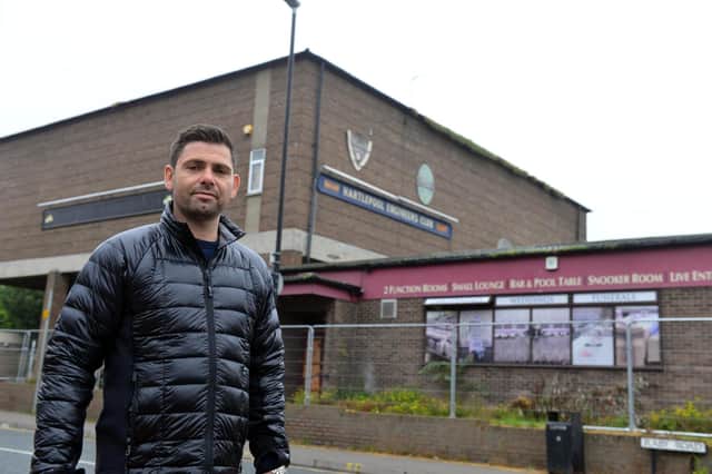 Rob Collier outside the former Engineers Social Club which has been fenced off ahead of redevelopment plans.