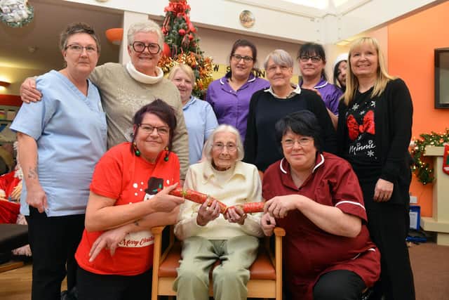Maisie Rymer celebrates her 105th birthday with Charlotte Grange Care Home staff.