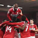 Marc Bola (top) joins the celebrations after Marcus Tavernier's goal for Middlesbrough.