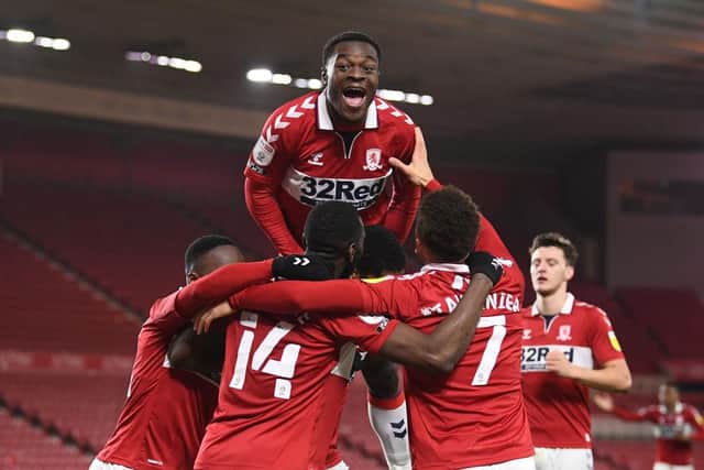 Marc Bola (top) joins the celebrations after Marcus Tavernier's goal for Middlesbrough.