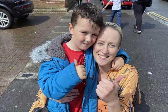Suzy Deakin, 44, dressed as a dinosaur with her son Jax,5.