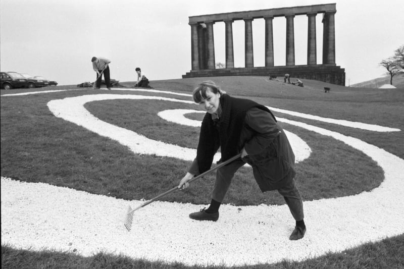 Artist Kate Whiteford spreads Skye gravel on her Celtic spiral design on Calton Hill Edinburgh, April 1987.