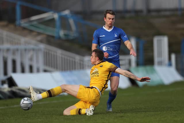 Sutton United's Ben Goodliffe clears from Rhys Oates of Hartlepool United during the Vanarama National League match between Hartlepool United and Sutton United at Victoria Park, Hartlepool on Saturday 30th January 2021. (Credit: Mark Fletcher | MI News)