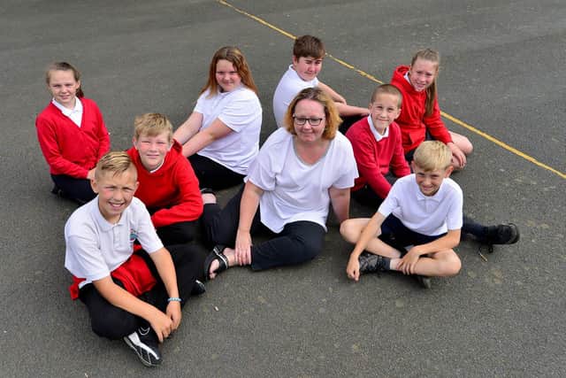 Headteacher Caroline Reed with pupils from Rossmere Primary School.