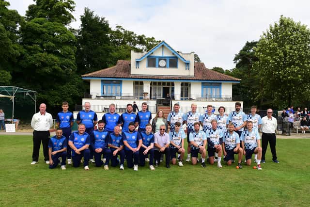 Bill and Pam Shurmer (middle front and back) with the teams before the charity cricket match in memory of Danny Shurmer.