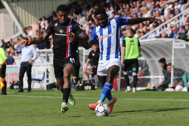 Zaine Francis-Angol of Hartlepool United in action with Carlisle United's Tristan Abrahams during the Sky Bet League 2 match between Hartlepool United and Carlisle United at Victoria Park, Hartlepool on Saturday 28th August 2021. (Credit: Mark Fletcher | MI News)