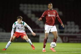 Nicke Kabamba of Northampton Town controls the ball watched by Sam Perry of Walsall during the Papa John's Trophy match between Northampton Town and Walsall at Sixfields on October 05, 2021 in Northampton, England. (Photo by Pete Norton/Getty Images)