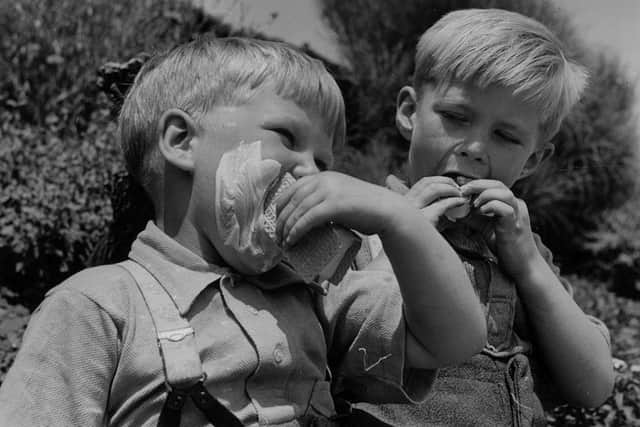 Tucking into an icy treat in June 1950. Picture: Norman Vigars/Fox Photos/Getty Images.