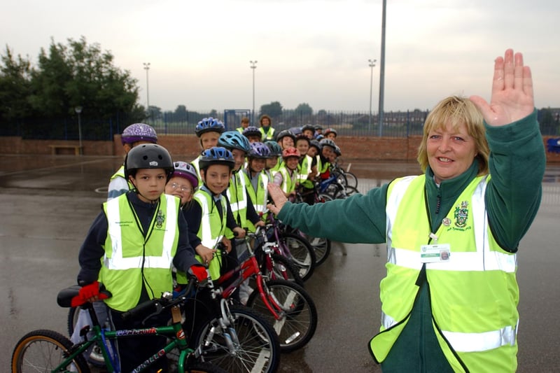 A 2005 scene at Mortimer Primary School. It shows cycling instructor Julie Watson testing Year 5 students on their road skills.