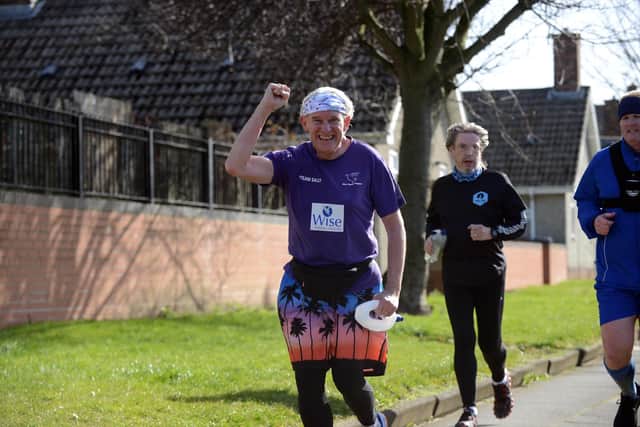 Phil Holbrook finishes his St Patrick's Day half marathon at St Patrick's RC Church, in Owton Manor Lane, Hartlepool.