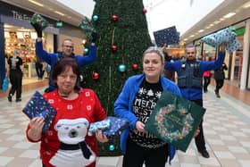 Middleton Grange security Michael Knight and Jordan Liddle with staff Christine Davis and Charlotte Bunton at the shopping centre's giving tree.