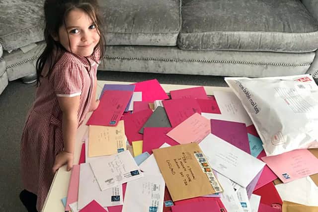 Lyla O'Donovan with some of the birthday cards she has received from wellwishers following an appeal by her dad Paul.