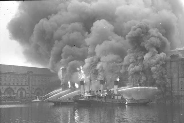 Boats in the dock fighting the match factory ablaze.