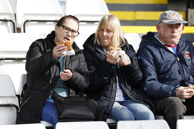 Fans tuck in to some food during half time. Mark Fletcher/MI News