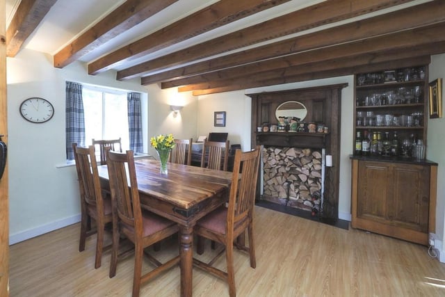 The delightful dining room has more than enough space for a table and chairs. It features laminate flooring, wall lights, a glazed window to the front of the property and double doors opening into the lounge.